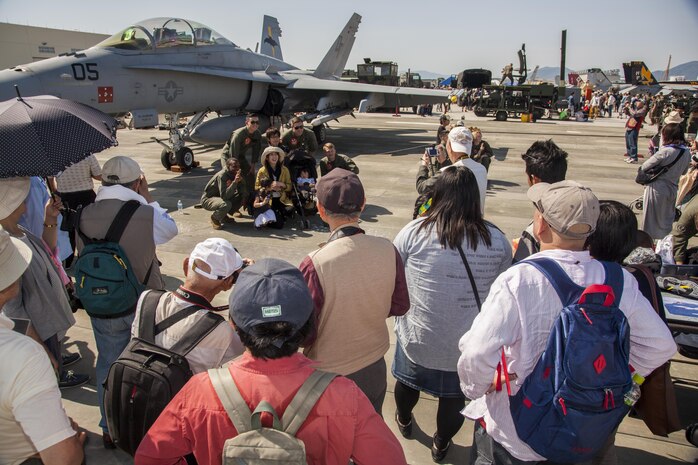 Event participants gather around a static display during the 40th Friendship Day Air Show at Marine Corps Air Station Iwakuni, Japan, May 5, 2016. Since 1973, MCAS Iwakuni has conducted a single-day air show and open house specifically designed to foster positive relationships between the air station and its  Japanese hosts, and the event traditionally draws more than 200,000 visitors and participants. This year is the 40th Friendship Day, offering a culturally-enriching experience that displays the mutual support between the U.S. and Japan. This annual event showcases a variety of static displays, aviation performances and demonstrations, and offers food and entertainment for guests of the largest single-day event in Iwakuni.  (U.S. Marine Corps photo by Gunnery Sgt. Ricardo Morales)