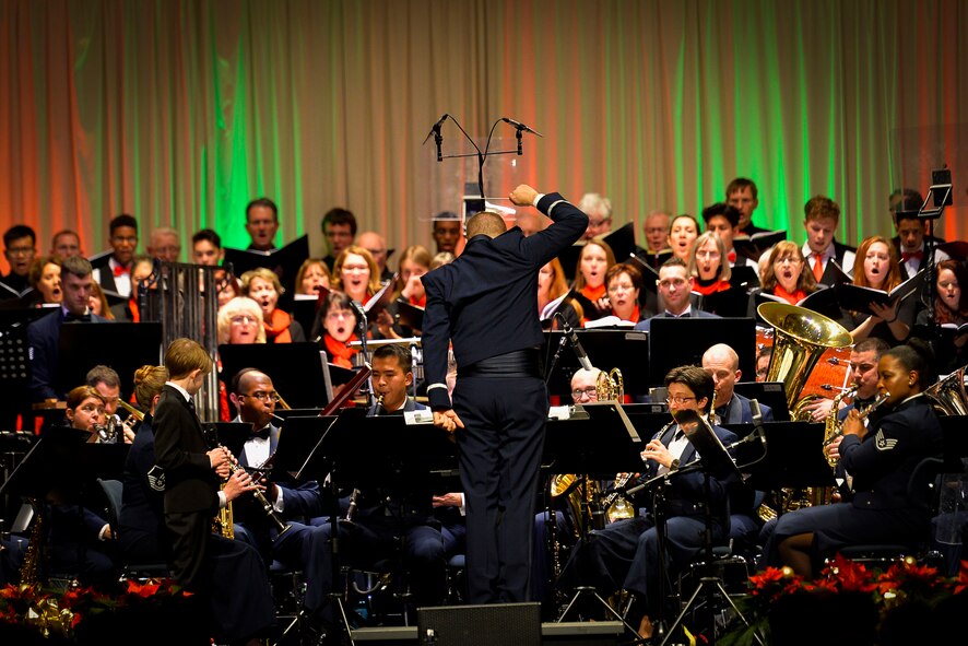 The U.S. Air Forces Europe Band, along with German and American choirs, performs a Christmas concert at Kaiserslautern, Germany, Dec. 16, 2016. The event took place to continue to strengthen social bonds between the U.S. military community and local community. (U.S. Air Force photo by Airman 1st Class Joshua Magbanua)