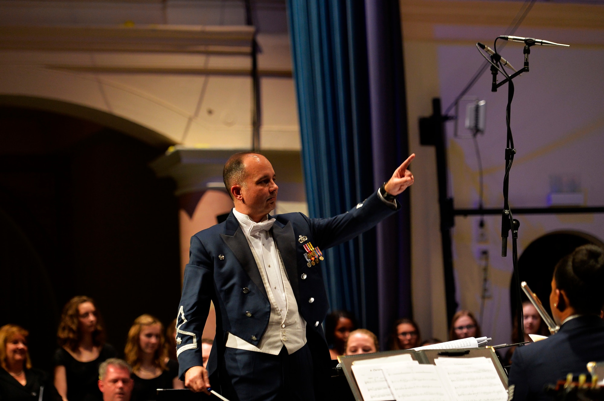 Lt. Col. Donald E. Schofield, U.S. Air Forces Europe Band conductor, conducts the USAFE Band’s Christmas performance at Kaiserslautern, Germany, Dec. 16, 2016. The performance featured not only the USAFE Band, but also German and American choirs. (U.S. Air Force photo by Airman 1st Class Joshua Magbanua)