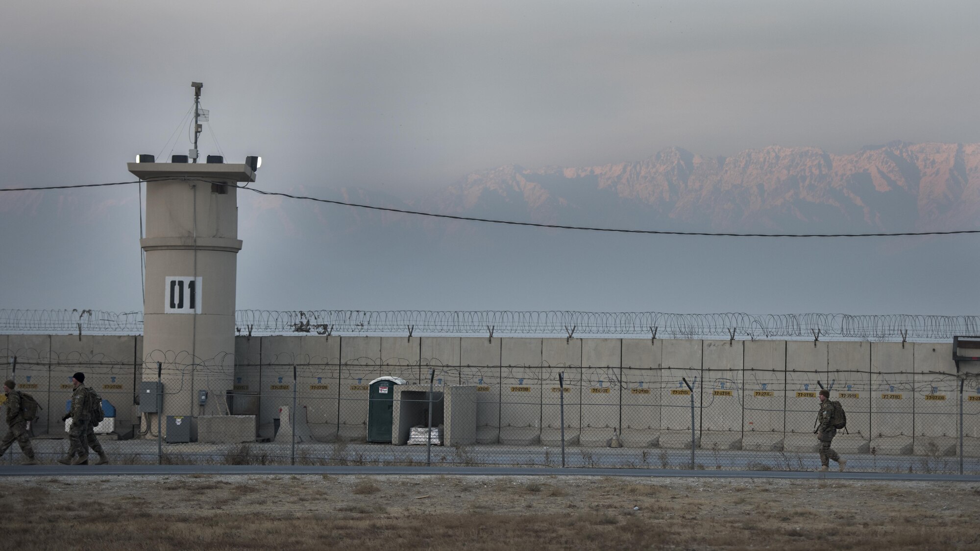 Air Force Office of Special Investigations Expeditionary Detachment 2405 and 455th Expeditionary Security Forces Squadron members participate in a “Ruck March to Remember” fallen comrades Dec. 21, 2016 at Bagram Airfield, Afghanistan. Task Force Crimson, which is primarily comprised of Air Force OSI and security forces Airmen, contributes to the joint, multinational force protection efforts for the Bagram Airfield area including outside-the-wire security. (U.S. Air Force photo by Staff Sgt. Katherine Spessa)