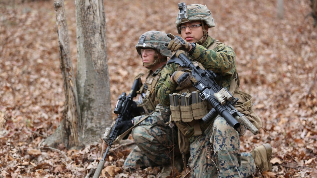 Lance Cpl. Kenny Menuezneri describes an objective’s location to Cpl. Timothy E. Buntting during a deployment for training exercise at Fort Pickett, Va., Dec. 4, 2016. The range was designed for Marines to prepare for their upcoming deployment to Okinawa, Japan. Menuezneri and Buntting are both riflemen with 3rd Battalion, 8th Marine Regiment, 2nd Marine Division.