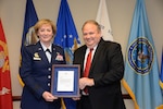 Air Force Lt. Gen. Wendy Masiello, Defense Contract Management Agency director, recognizes Jim Russell, her deputy, at a Dec. 19 retirement ceremony at Fort Lee, Virginia. Russell retired after 36 years of federal service, mostly with DCMA or its predecessor organizations. (DCMA photo by Stephen Hickok)