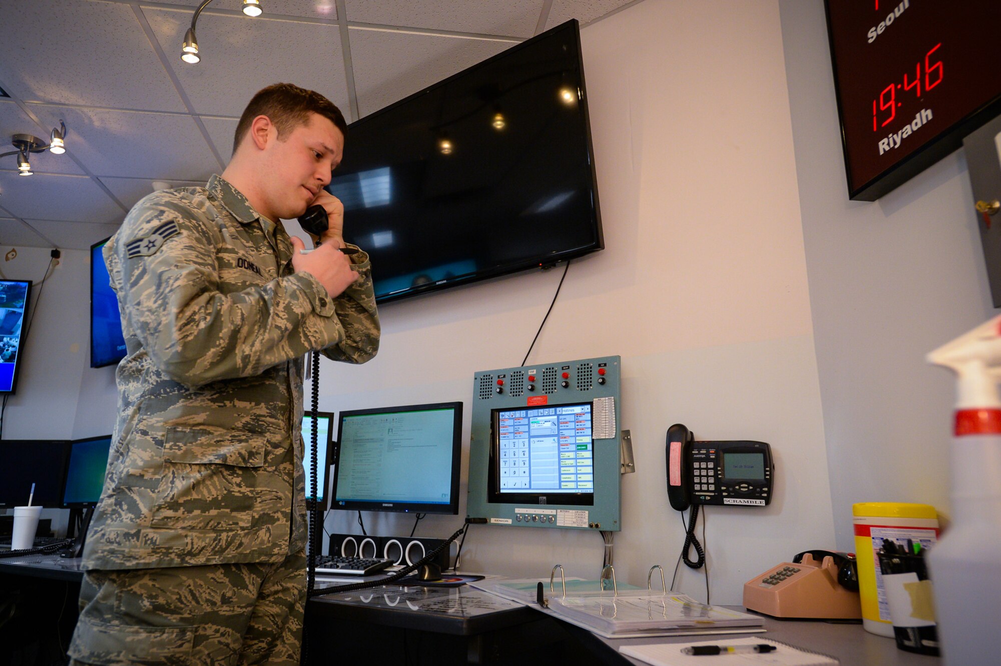 Emergency Actions Controller Senior Airman Jeremy Odneal answers a response call in the command post at Hill Air Force Base, Utah, Nov. 18, 2016. The command post is manned at all times by two certified emergency actions controllers. Both active-duty and Reserve Airmen operate the Hill Command Post. (U.S. Air Force photo by R. Nial Bradshaw)