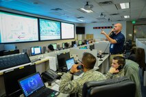 Emergency actions controllers Airman 1st Class Meggan Van Atta, Master Sgt. Jeremy Smith, and Senior Airman Jeremy Odneal answer response calls in the Hill Command Post, Nov. 18, 2016. Command post specialists ensure base operations and communications run efficiently and effectively under any circumstance by providing command, control, communications and information support. (U.S. Air Force photo by R. Nial Bradshaw)