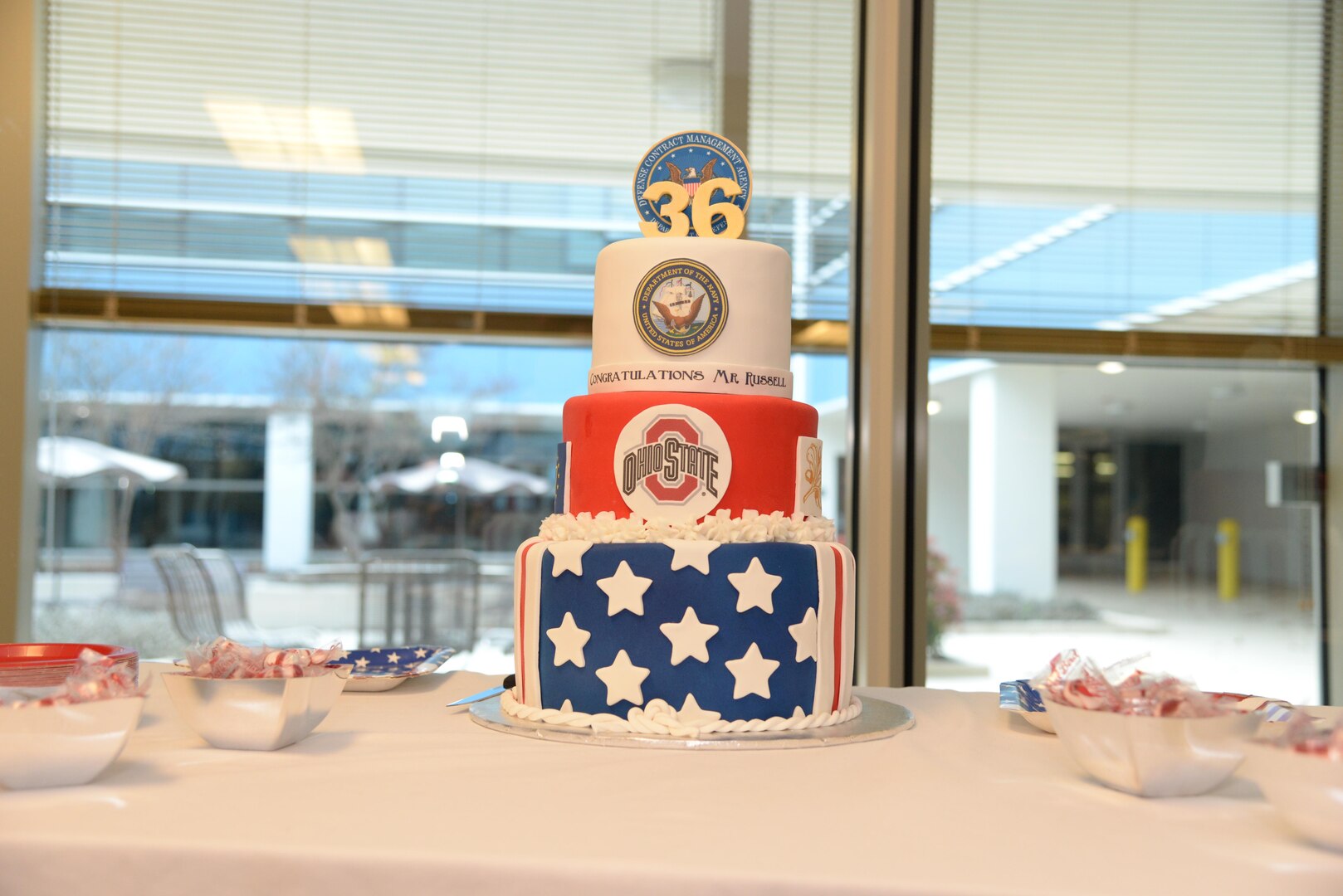 A cake awaits those gathered to celebrate Jim Russell retirement at a Dec. 19 ceremony at Fort Lee, Virginia. Russell retired as deputy director of the Defense Contract Management Agency after 36 years of federal service. (DCMA photo by Stephen Hickok)