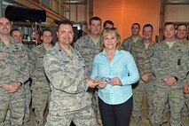 U.S. Air Force Maj. Neil, 380th Expeditionary Civil Engineering Squadron, presents Oklahoma Gov. Mary Fallin one of his flight’s coins during her visit to an undisclosed location in Southwest Asia, Dec. 7 2016; Fallin also presented Neil with one of her own coins. Many of the 380th ECES members are deployed to the 380th Air Expeditionary Wing from the 137th Special Operations Wing, Oklahoma Air National Guard. (U.S. Air Force photo by Tech. Sgt. Christopher Carwile)