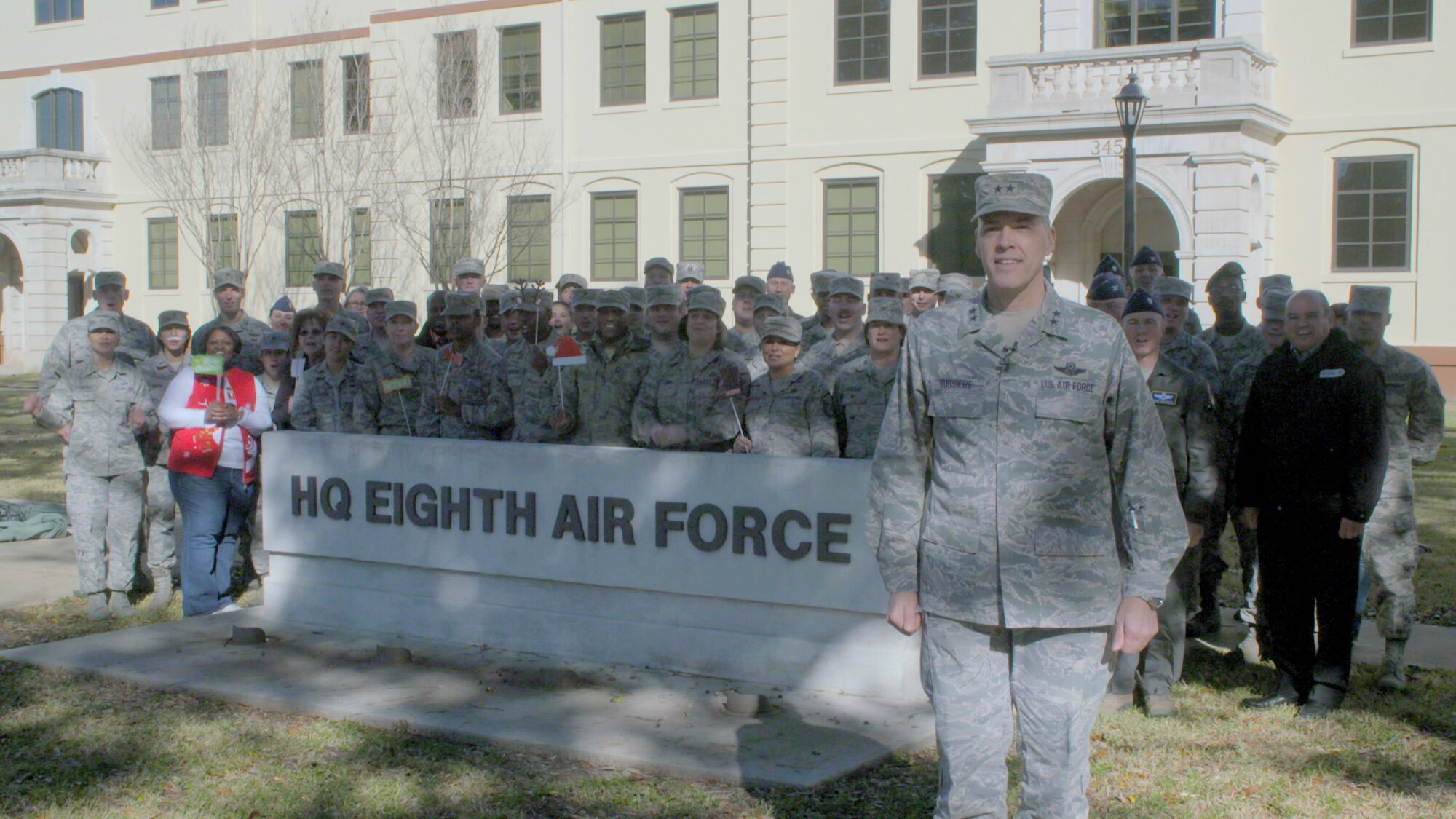 U.S. Air Force Maj. Gen. Thomas Bussiere, Eighth Air Force commander, along with members of the 608th Air Operations Center and Eighth Air Force staff deliver a holiday greeting with KSLA-TV (ABC) for the local Shreveport and Bossier City, LA communities Dec. 19, 2016. (U.S. Air Force photo by SrA Gabriel Stuart)