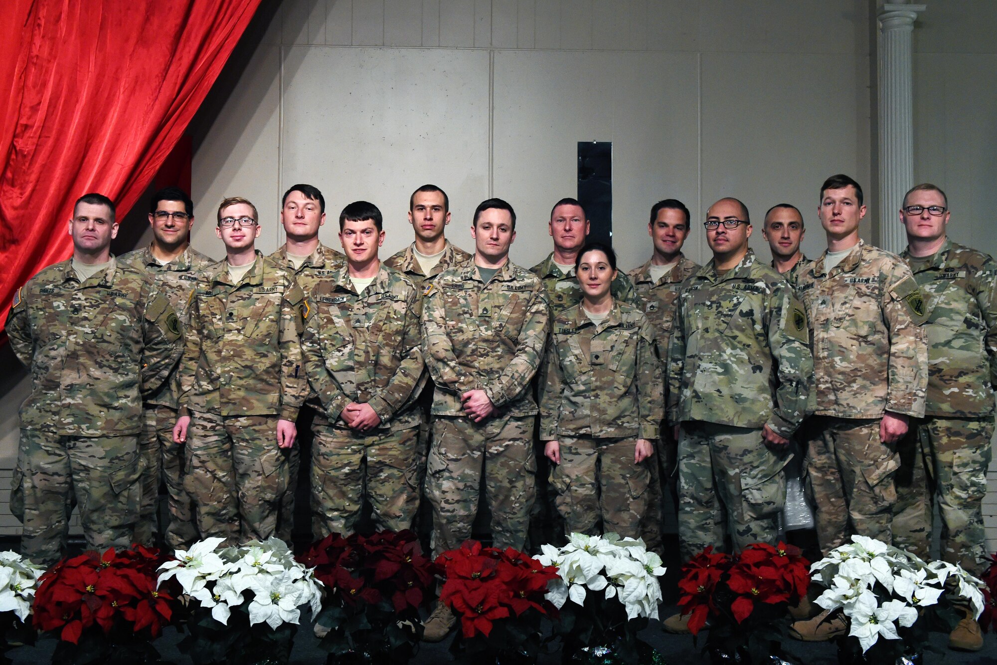Soldiers from the 316th Psychological Operations Company stationed at Grissom Air Reserve Base, Ind., pose for a photo during a Welcome Home Warrior-Citizen award ceremony in Kokomo, Ind., Dec. 10, 2016. The soldiers received the award for their service during a deployment to the Horn of Africa from October 2015 to June 2016. (U.S. Air Force photo/Tech. Sgt. Benjamin Mota)