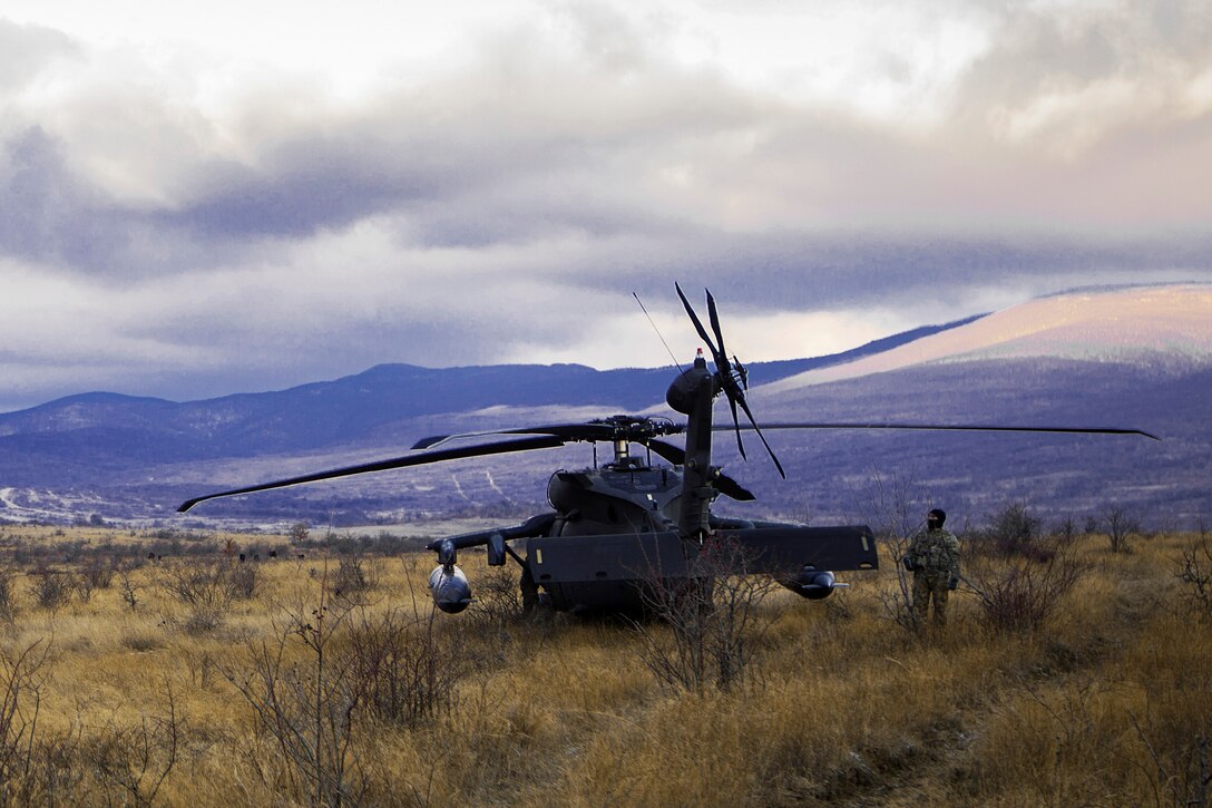 A U.S. soldier prepares a UH-60 Black Hawk helicopter for take off during Platinum Lion, a training exercise, at Novo Selo Training Area, Bulgaria, Dec. 21, 2016. Marine Corps photo by Lance Cpl. Timothy J. Lutz