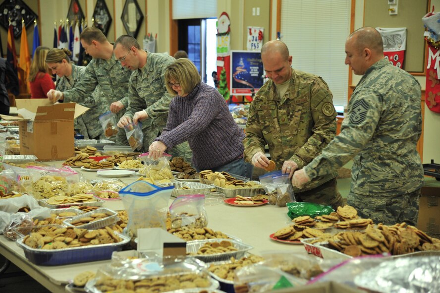 Volunteers from the base participate in the annual Cookie Express at the Grizzly Bend Dec. 15, 2016, at Malmstrom Air Force Base, Mont. Volunteers collected over 1,000 dozen cookies, almost double this year’s goal to give to dorm residents and 24-hour work centers. (U.S. Air Force photo/John Turner)

