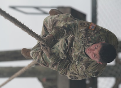Staff. Sgt. Jody T. McIlroy, G2 section, Headquarters Support Company, Headquarters, Headquarters Battalion, U.S. Army North (Fifth Army) from Joint Base San 
Antonio-Fort Sam Houston navigates one of the obstacles of the confidence course during the first Guardian Challenge at JBSA-Camp Bullis Dec. 9. 

