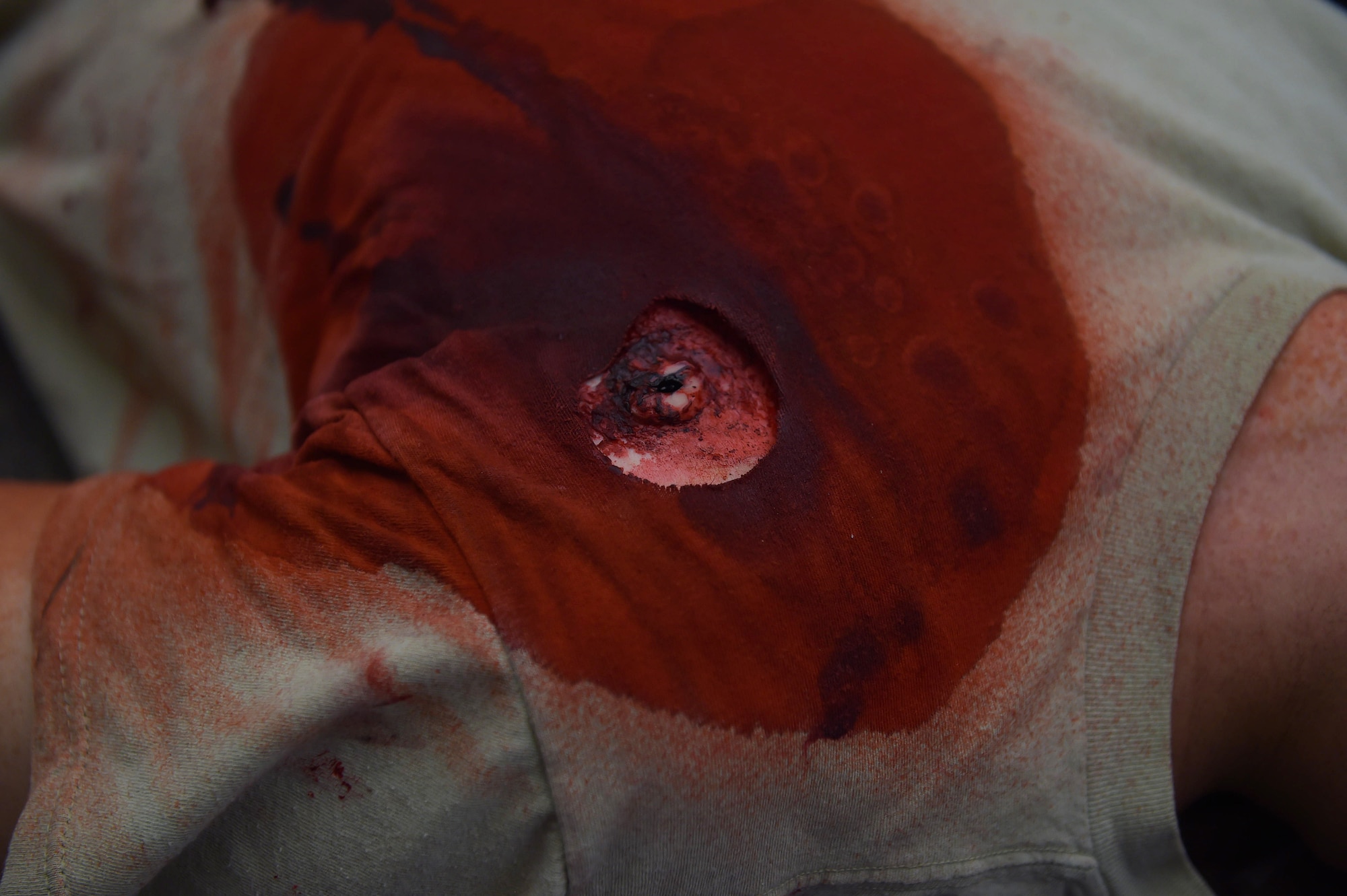 A simulated gunshot victim lays on the floor at the 633rd Civil Engineer Squadron building during an active shooter exercise at Joint Base Langley-Eustis, Va., Dec. 15, 2016. After the building was cleared by the 633rd Security Forces Squadron, first responders from other agencies arrived to treat the individuals with simulated injuries. (U.S. Air Force photo by Senior Airman Kimberly Nagle)