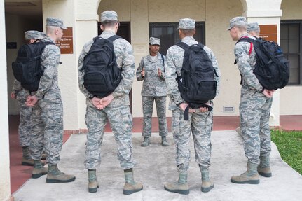 Master Sgt. Kelli Jackson (center), 558th Flying Training Squadron military training leader and superintendent, speaks with basic sensor operator technical training Airmen at Joint Base San Antonio-Randolph Dec. 14, 2016. Jackson wears a blue aiguillette, or rope, on her left shoulder to signify her as an MTL. (U.S. Air Force photo by Airman 1st Class Lauren Parsons/Released)