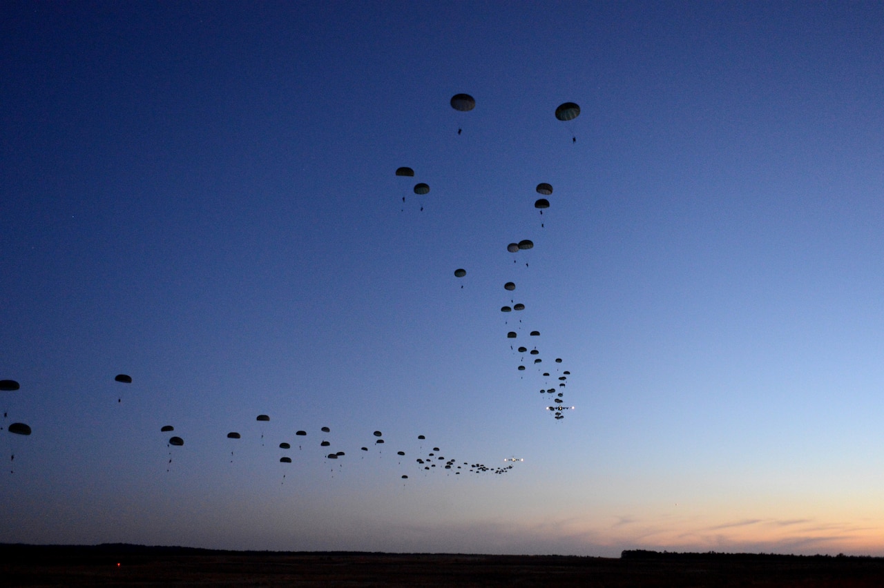 Soldiers from the 1st Battalion, 508th Parachute Infantry Regiment, conduct a static-line airdrop from an Air Force C-17 Globemaster III aircraft during Joint Operational Access Exercise 13-02 at Sicily drop zone, Fort Bragg, N.C., Feb. 24, 2013. The JOAX exercises are a combined exercises that enables U.S. and Canadian mobility aircrews to train with paratroopers from the Army's 82nd Airborne Division on projecting combat power in a denied environment -- one of the future-war challenges areas that spurred the department to launch the recent Operational Challenges Crowdsourcing Initiative. Air Force photo by Tech. Sgt. Jason Robertson