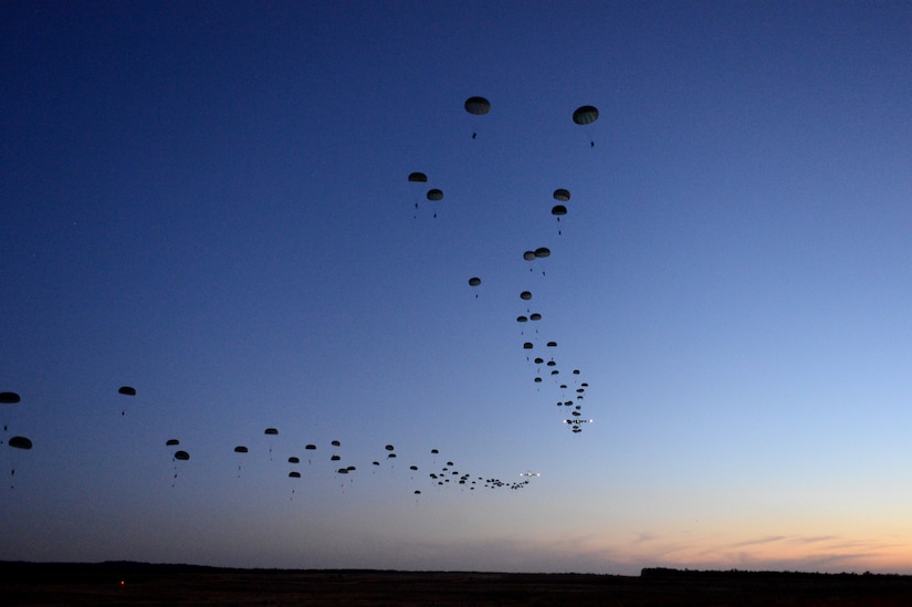 Soldiers from the 1st Battalion, 508th Parachute Infantry Regiment, conduct a static-line airdrop from an Air Force C-17 Globemaster III aircraft during Joint Operational Access Exercise 13-02 at Sicily drop zone, Fort Bragg, N.C., Feb. 24, 2013. The JOAX exercises are a combined exercises that enables U.S. and Canadian mobility aircrews to train with paratroopers from the Army's 82nd Airborne Division on projecting combat power in a denied environment -- one of the future-war challenges areas that spurred the department to launch the recent Operational Challenges Crowdsourcing Initiative. Air Force photo by Tech. Sgt. Jason Robertson