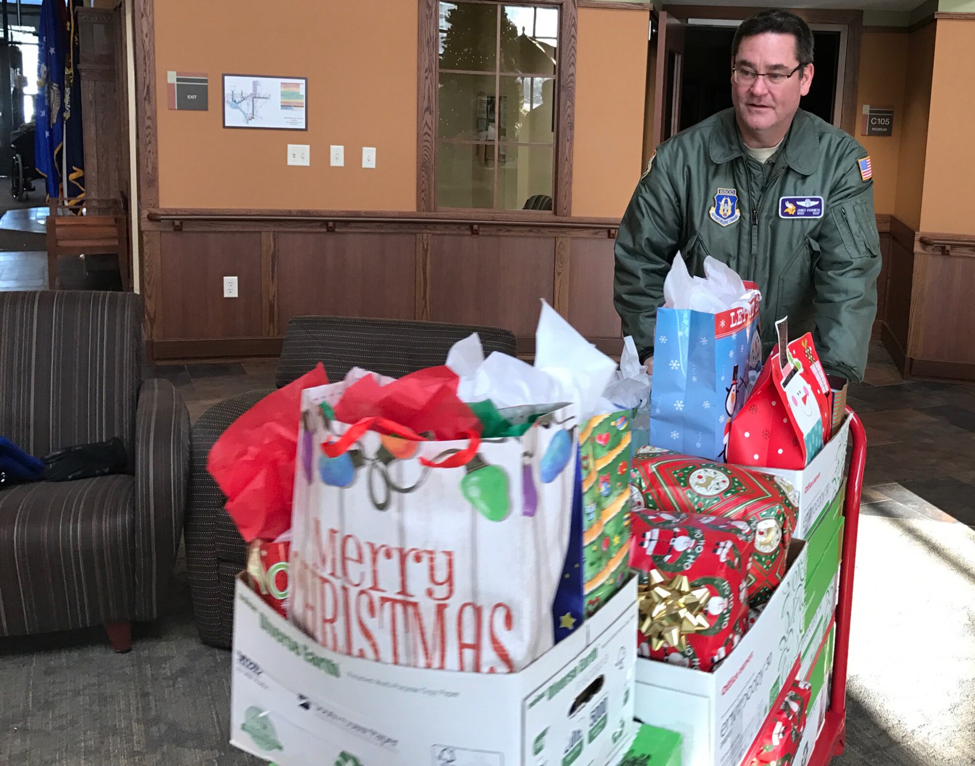Master Sgt. James Courneya, 934th Operations Group, delivers a load of gifts at the Minnesota Veteran's Home Dec. 15.