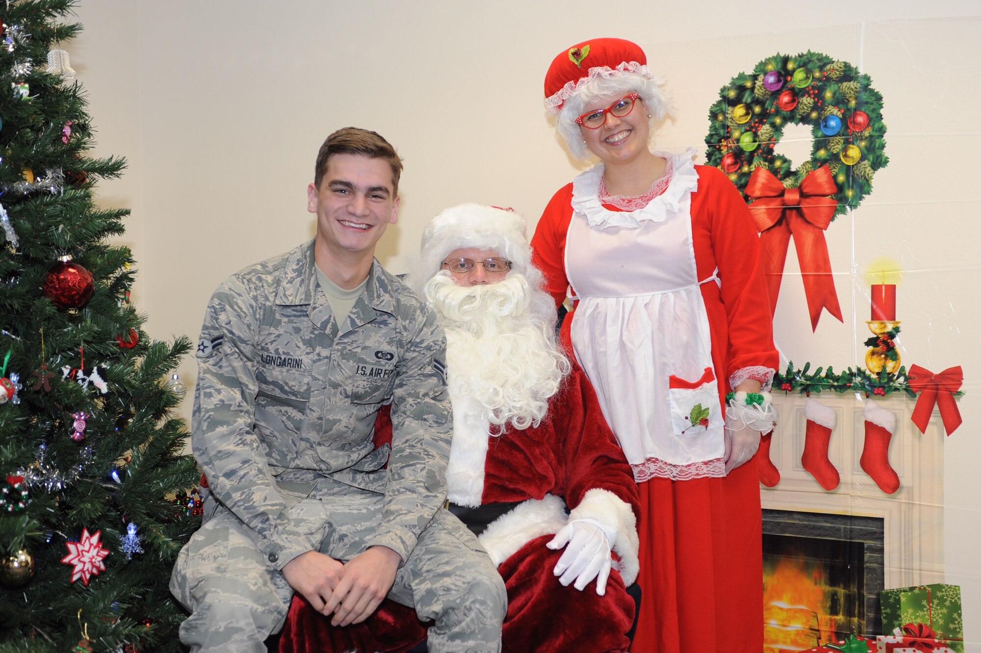 Senior Airman Ricardo Longarini, 92nd Air Refueling Squadron aviation resource manager, celebrates the holiday season with Santa and Mrs. Claus Dec. 14, 2015, at Incirlik Air Base, Turkey. Longarini spent more than four months at Incirlik assisting in setting up the 22nd Expeditionary Air Refueling Squadron. (Courtesy Photo)
