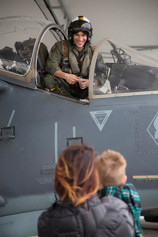 Maj. Matthew Martinez is welcomed by his family during a homecoming at Marine Corps Air Station Cherry Point, N.C., Dec. 19, 2016. A detachment of Marines from Marine Attack Squadron 542, Marine Aircraft Group 14, 2nd Marine Aircraft Wing, were attached to Marine Medium Tiltrotor Squadron 264 (Reinforced), Marine Aircraft Group 26, 2nd MAW, 22nd Marine Expeditionary Unit. The 22nd MEU, deployed with the Wasp Amphibious Ready Group, conducted naval operations in support of U.S. national security interests in Europe.Martinez is an AV-8B Harrier II pilot assigned to VMA-542. (U.S. Marine Corps photo by Sgt. N.W. Huertas/ Released)