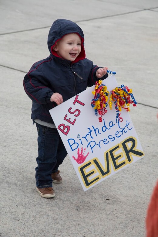 Maj. Nicholas Tyson's son, William, eagerly awaits the return of his father during a homecoming event aboard Marine Corps Air Station Cherry Point, N.C., Dec. 19, 2016. A detachment of Marines assigned to Marine Attack Squadron 542, Marine Aircraft Group 14, 2nd Marine Aircraft Wing were attached to Marine Medium Tiltrotor Squadron 264 (Reinforced), 22nd Marine Expeditionary Unit. The 22nd MEU, deployed with the Wasp Amphibious Ready Group, conducted naval operations in support of U.S. national security interests in Europe. Tyson is an AV-8B Harrier II pilot assigned to VMA-542. (U.S. Marine Corps photo by Sgt. N.W. Huertas/ Released)