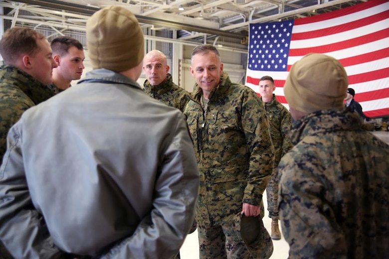 Sgt. Maj. Howard Kreamer, center, and Brig. Gen. Matthew Glavy greet Marines during a homecoming at Marine Corps Air Station Cherry Point, N.C., Dec. 19, 2016. A detachment of Marines from Marine Attack Squadron 542, Marine Aircraft Group 14, 2nd Marine Aircraft Wing, were attached to Marine Medium Tiltrotor Squadron 264 (Reinforced), Marine Aircraft Group 26, 2nd MAW, 22nd Marine Expeditionary Unit. The 22nd MEU, deployed with the Wasp Amphibious Ready Group, conducted naval operations in support of U.S. national security interests in Europe.Glavy is the commanding general of 2nd MAW and Kreamer is the sergeant major of 2nd MAW.  (U.S. Marine Corps photo by Sgt. N.W. Huertas/ Released)