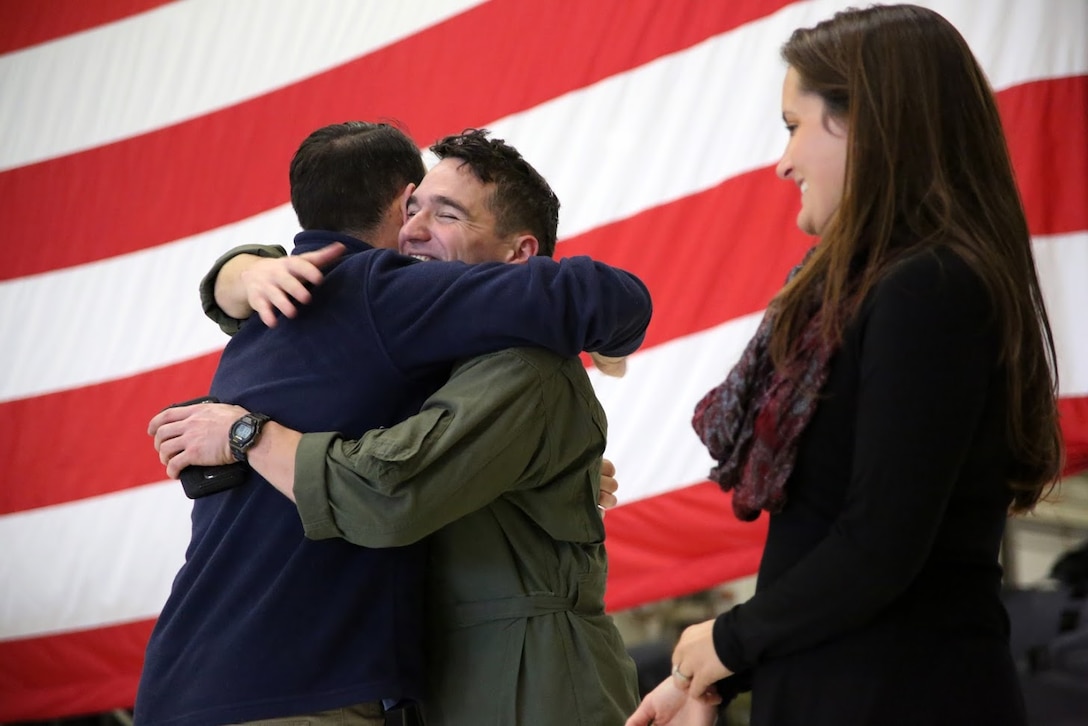 Capt. Brian Neri is welcomed by his family during a homecoming at Marine Corps Air Station Cherry Point, N.C., Dec. 19, 2016. A detachment of Marines from Marine Attack Squadron 542, Marine Aircraft Group 14, 2nd Marine Aircraft Wing, were attached to Marine Medium Tiltrotor Squadron 264 (Reinforced), Marine Aircraft Group 26, 2nd MAW, 22nd Marine Expeditionary Unit. The 22nd MEU, deployed with the Wasp Amphibious Ready Group, conducted naval operations in support of U.S. national security interests in Europe. Neri is an AV-8B Harrier II pilot assigned to VMA-542.  (U.S. Marine Corps photo by Sgt. N.W. Huertas/ Released)