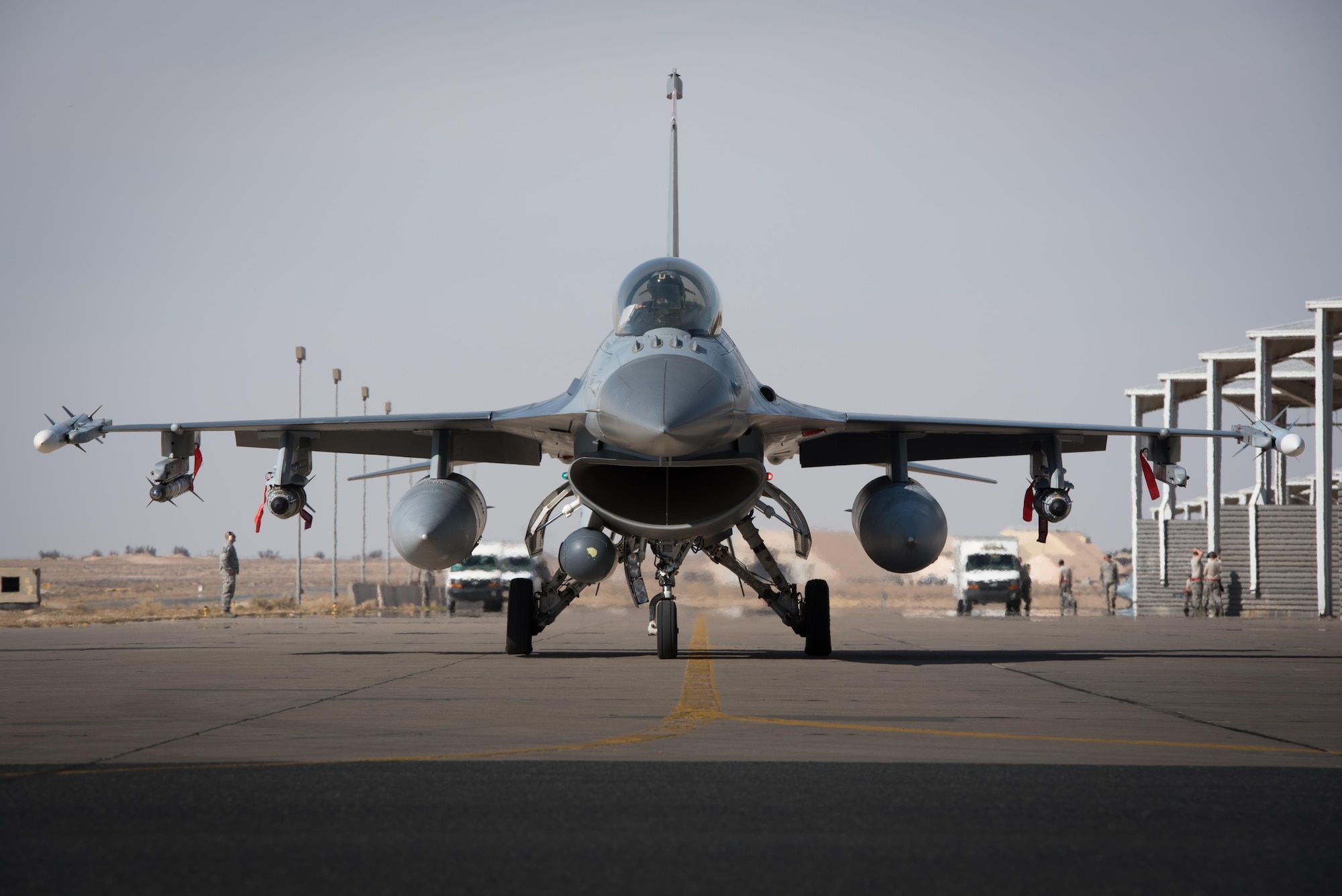 An F-16 Fighting Falcon deployed with the 134th Expeditionary Fighter Squadron taxies for a combat mission from the 407th Air Expeditionary Group, Southwest Asia, Dec. 13, 2016. The unit was able to fly combat operations within 15 hours of arriving at the deployed location.(U.S. Air Force photo/Master Sgt. Benjamin Wilson)(Released)