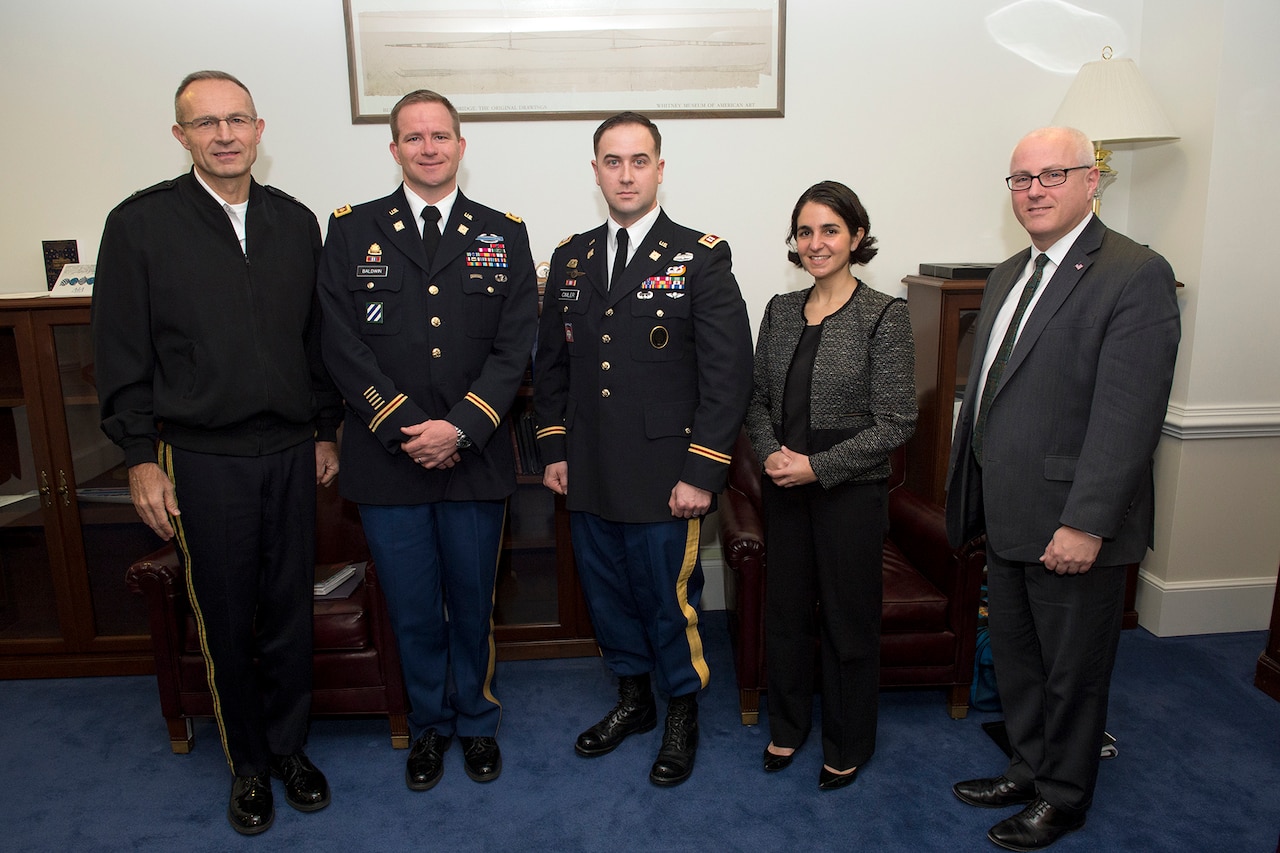 Deputy Director for Regional Operations and Force Management Army Brig. Gen. Randy George, Army Maj. Christopher M. Baldwin, Army Capt. Nicholas W. Cimler, Deputy Assistant Secretary of Defense for Strategy and Force Development Mara E. Karlin and Assistant Secretary of Defense for Research and Engineering Steve Welby pose for a photo at the Pentagon in Arlington, Va., Dec. 20, 2016. DoD photo by EJ Hersom