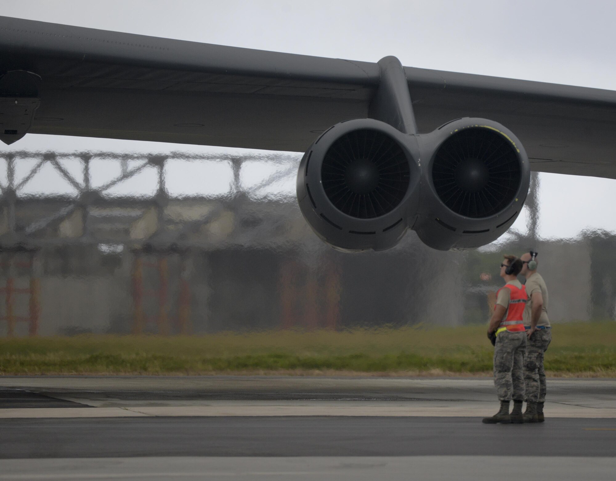 U.S. Airmen deployed from Minot Air Force Base, North Dakota, inspect a B-52 Stratofortress engine during takeoff preparations on Andersen Air Force Base, Guam, Dec. 17, 2016. U.S. Air Force bombers deploy routinely to support ongoing operations in the  Indo-Asia-Pacific region.  (U.S. Air Force photo by Staff Sgt. Benjamin Gonsier/Released)  