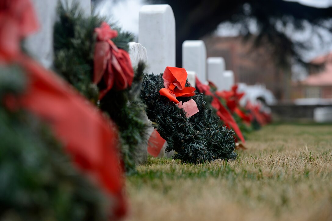 Wreaths are laid during a National Wreaths Across America Remembrance ceremony at Hampton National Cemetery in Hampton, Va., Dec. 17, 2016. More than 1,500 wreaths were donated in honor of fallen heroes, who were laid to rest at the cemetery. (U.S. Air Force photo by Airman 1st Class Kaylee Dubois)