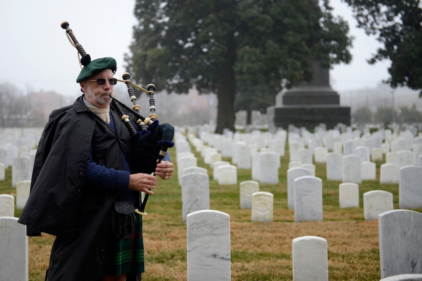Retired U.S. Merchant Marine Joseph Overstreet, Jr., Scottish American Military Society representative, performs “Flowers of the Forest,” on bag pipes during a National Wreaths Across America Remembrance ceremony at Hampton National Cemetery in Hampton, Va., Dec. 17, 2016. Ceremonial wreaths were presented to each branch of the military. (U.S. Air Force photo by Airman 1st Class Kaylee Dubois)