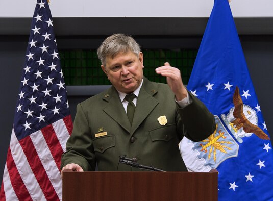 Dean Alexander, Dayton Aviation Heritage National Historical Park superintendent, serves as the keynote speaker during the commemoration of the 113th anniversary of the Wright brothers’ first powered flight on Dec. 16, 2016, at the Wright Brothers Memorial on Wright-Patterson Air Force Base, Ohio. Following several speakers, the observation moved outside for a wreath-laying and flyover of a P-51D Mustang, a World War II era fighter. (U.S. Air Force photo/R.J. Oriez)