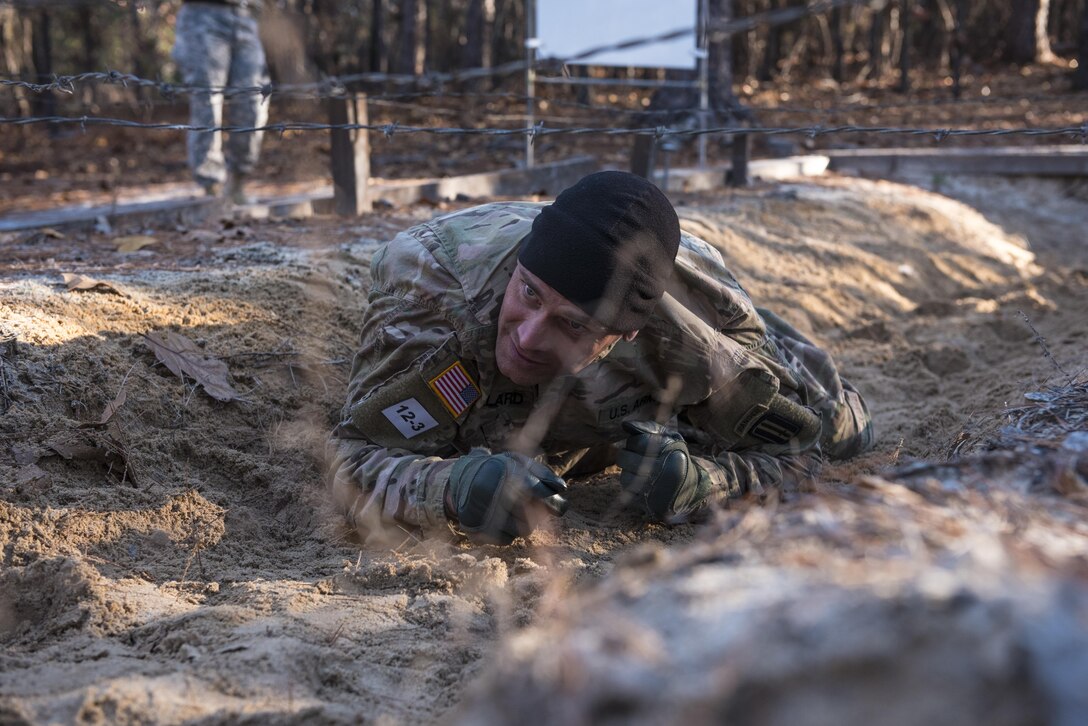 First Sgt. Aaron Bullard, Company A, 3rd Battalion, 60th Infantry Regiment, attempts to complete the belly crawl obstacle during the Rubicon Command Team Challenge, Dec. 9. The Rubicon Command Team Challenge was designed to exercise the leadership and combat skills for the company command teams within the 193rd Infantry Brigade, while at the same time building esprit de corps among the different teams. The challenge was held Dec. 8-9, 2016 at Fort Jackson, S.C. (U.S. Army Reserve photo by Sgt. 1st Class Brian Hamilton/ released)