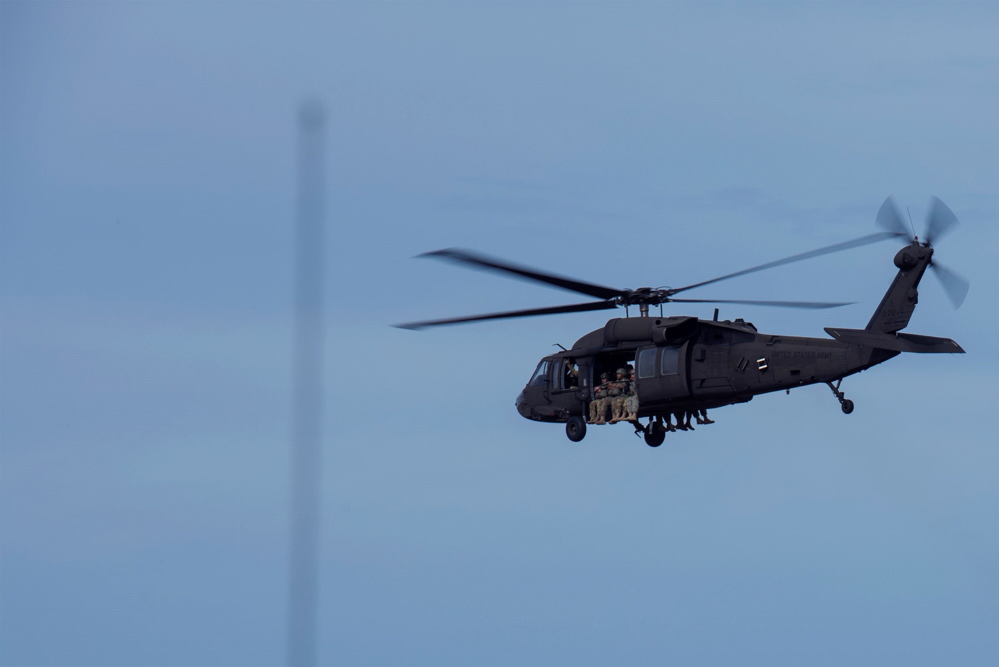 U.S. Army airborne specialists launch in an Army UH-60 Black Hawk during the 19th Annual Randy Oler Memorial Operation Toy Drop, Dec. 14, 2016, at Mackall Army Air Field, N.C. Nine nations participated in airborne training during the two-week event which consisted of standardization jump and aircraft familiarization on seven airframes. (U.S. Air Force photo by Airman 1st Class Greg Nash)   