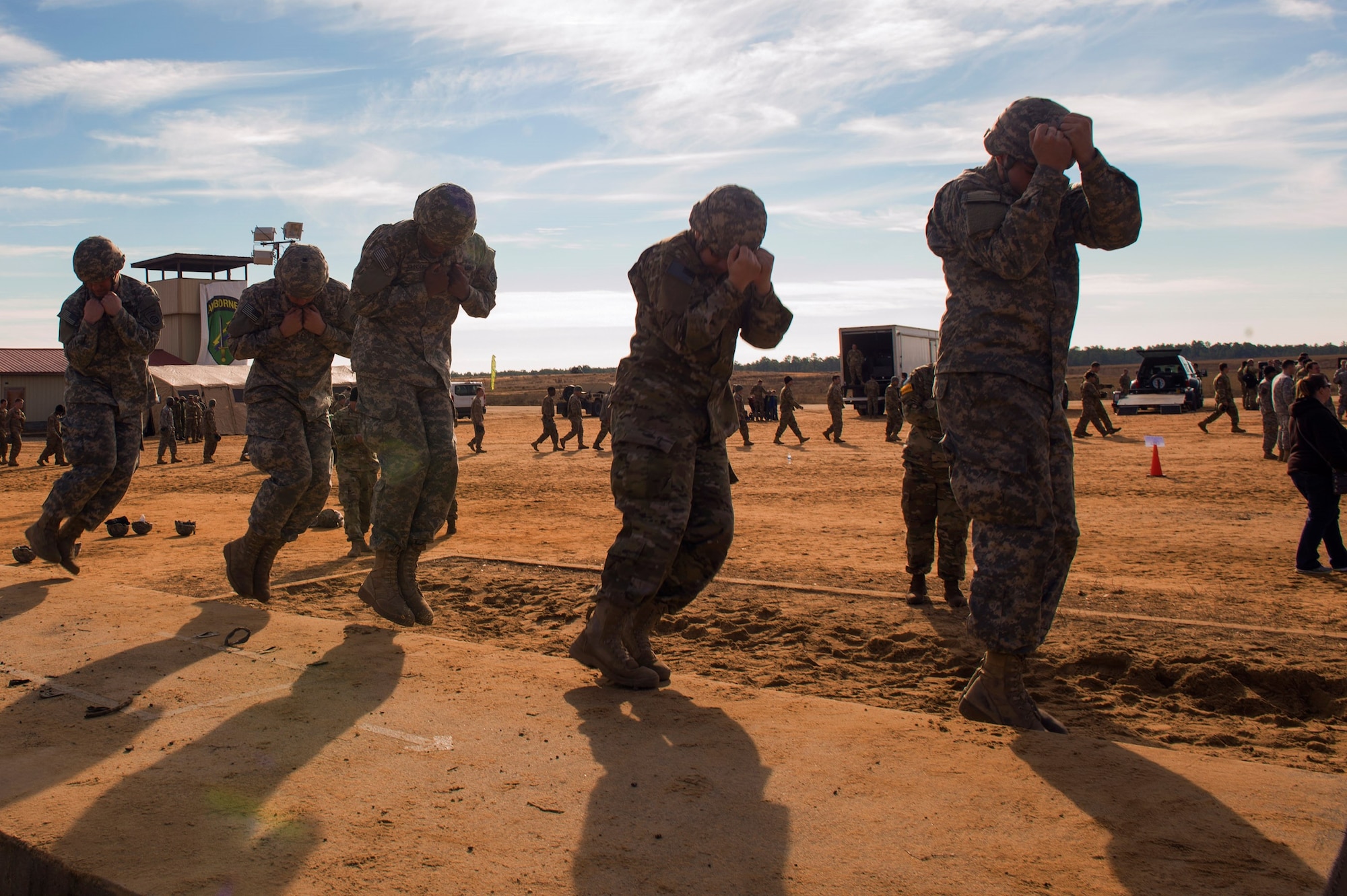 U.S. Army soldiers from the 82nd Sustainment Brigade, Fort Bragg, N.C., perform sustained airborne training prior to flying during the 19th Annual Randy Oler Memorial Operation Toy Drop, Dec. 14, 2016, at Luzon Drop Zone, Camp Mackall, N.C. Each unit performed refresher training on how to execute static line and military free fall training before relearning with a foreign nation. (U.S. Air Force photo by Airman 1st Class Greg Nash)   