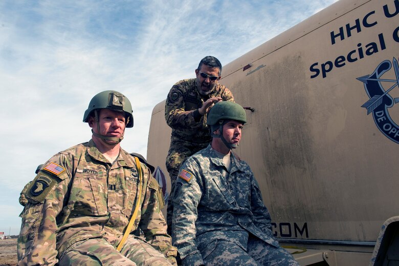 Italian army Sergeant Pau Esercito, Brigata Folgone airborne jumpmaster, gives Italian commands to U.S Army airborne specialists as a part of training during the 19th Annual Randy Oler Memorial Operation Toy Drop, Dec. 15, 2016, Mackall Army Air Field, N.C. To lessen cultural barriers, U.S. Armed Forces had to learn foreign preparatory commands to communicate before parachuting from their aircraft with jumpmasters to earn their wings. (U.S. Air Force photo by Airman 1st Class Greg Nash)   