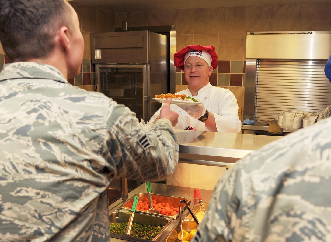PETERSON AIR FORCE BASE, Colo. – Col. Erich Novak, 302nd Airlift Wing vice commander, serves meals to Airmen at the Aragon Dining Facility here Dec. 3, 2016 during the Unit Training Assembly weekend. The Reserve wing’s senior leaders take part in the holiday tradition to show their appreciation for the Airmen of the 302nd AW. (U.S. Air Force photo/ Staff Sgt. Amber Sorsek)