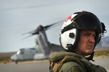 A pilot with the 15th Marine Expeditionary Unit looks onward Dec. 12, 2016, at Desert Rock Airport, Nev. The pilot waited to evacuate embassy role players as Marines finished processing Creech Airmen during a non-combatant evacuation operation scenario. (U.S. Air Force photo by Airman 1st Class James Thompson) 