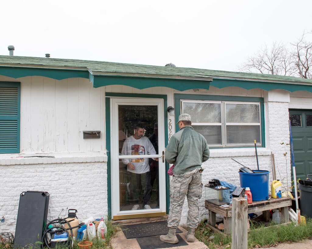 U.S. Air Force Airman 1st Class Jason Jordan, 7th Civil Engineering Squadron Explosive Ordinance Disposal Technician, brings a meal to one of the customers in Abilene, Texas, Dec. 15, 2016. Many Airmen volunteer to give something back to the community. (U.S. Air Force photo by Airman 1st Class Austin Mayfield)  