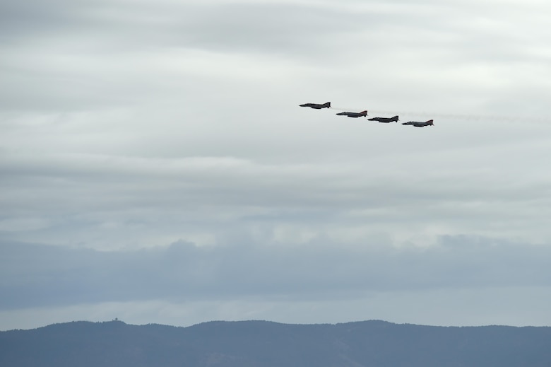 A QF-4 Phantom Four Ship formation flies over Holloman Air Force, Base, N.M., during the Phinal Phlight event on Dec. 21, 2016. This event marks the end of the aircraft’s 53 years of service to the Air Force. (U.S. Air Force photo by Staff Sgt. Eboni Prince)