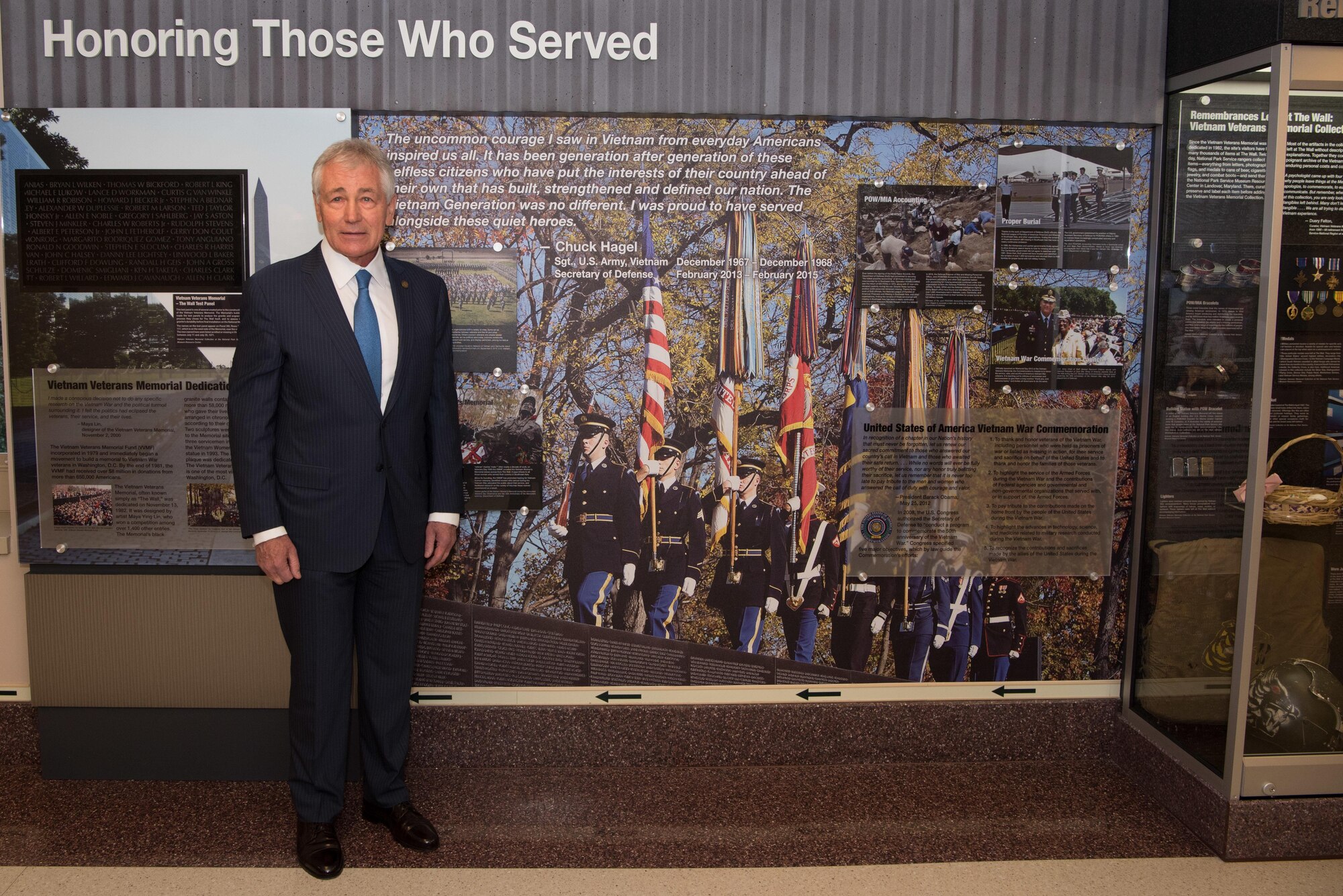 Former Secretary of Defense Chuck Hagel stands next to his quote in a hallway dedicated to veterans of the Vietnam War at the Pentagon in Washington, D.C., Dec. 20, 2016. (DOD photo by U.S. Air Force Staff Sgt. Jette Carr)