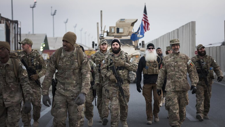 Air Force Office of Special Investigations Expeditionary Detachment 2405 and 455th Expeditionary Security Forces Squadron members ruck march Dec. 21, 2016 at Bagram Airfield, Afghanistan. The two units held a “Ruck March to Remember” six fallen comrades who lost their lives during an improvised explosive device attack one year earlier. (U.S. Air Force photo by Staff Sgt. Katherine Spessa)