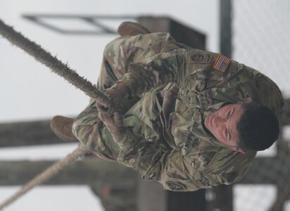 Staff. Sgt. Jody T. McIlroy, G2 section, Headquarters Support Company, Headquarters, Headquarters Battalion, U.S. Army North (Fifth Army) from Joint Base San 
Antonio-Fort Sam Houston navigates one of the obstacles of the confidence course during the first Guardian Challenge at JBSA-Camp Bullis Dec. 9. 
