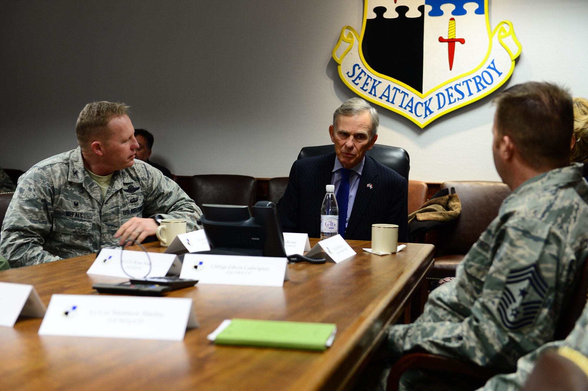 David McKean, middle, U.S. Ambassador to Luxembourg, is briefed by Col. Joe McFall, left, 52nd Fighter Wing commander, and Chief Master Sgt. Edwin Ludwigsen, right, 52nd FW command chief, at the wing headquarters building after arriving at Spangdahlem Air Base, Germany, Dec. 20, 2016. This was McKean's first visit to the base as he was briefed by leadership about the Saber Nation mission and different capabilities of the base during his tour. McKean was sworn in as Ambassaor in March 2016. (U.S. Air Force photo by Senior Airman Joshua R. M. Dewberry)
