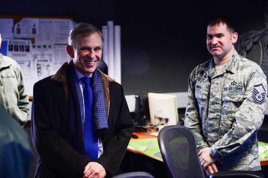 David McKean, left, U.S. Ambassador to Luxembourg, is briefed by Master Sgt. Gerald Null, right, 52nd Operations Support Squadron air traffic control watch supervisor, in the air traffic control tower on Spangdahlem Air Base, Germany, Dec. 20, 2016. This was McKean's first visit to the base as he was briefed by leadership about the Saber Nation mission and different capabilities of the base during his tour. McKean was sworn in as Ambassaor in March 2016. (U.S. Air Force photo by Senior Airman Joshua R. M. Dewberry)