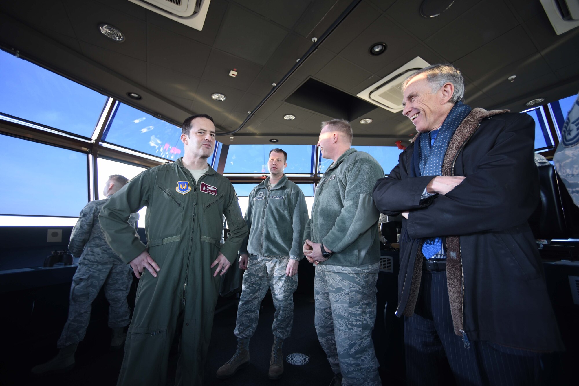 David McKean, right, U.S. Ambassador to Luxembourg, is briefed by Lt. Col. Ryan Nudi, left, 52nd Operations Support Squadron commander, in the air traffic control tower about the unit's mission and impotance at Spangdahlem Air Base, Germany, Dec. 20, 2016. This was McKean's first visit to the base as he was briefed by leadership about the Saber Nation mission and different capabilities of the base during his tour. McKean was sworn in as Ambassaor in March 2016. (U.S. Air Force photo by Senior Airman Joshua R. M. Dewberry)