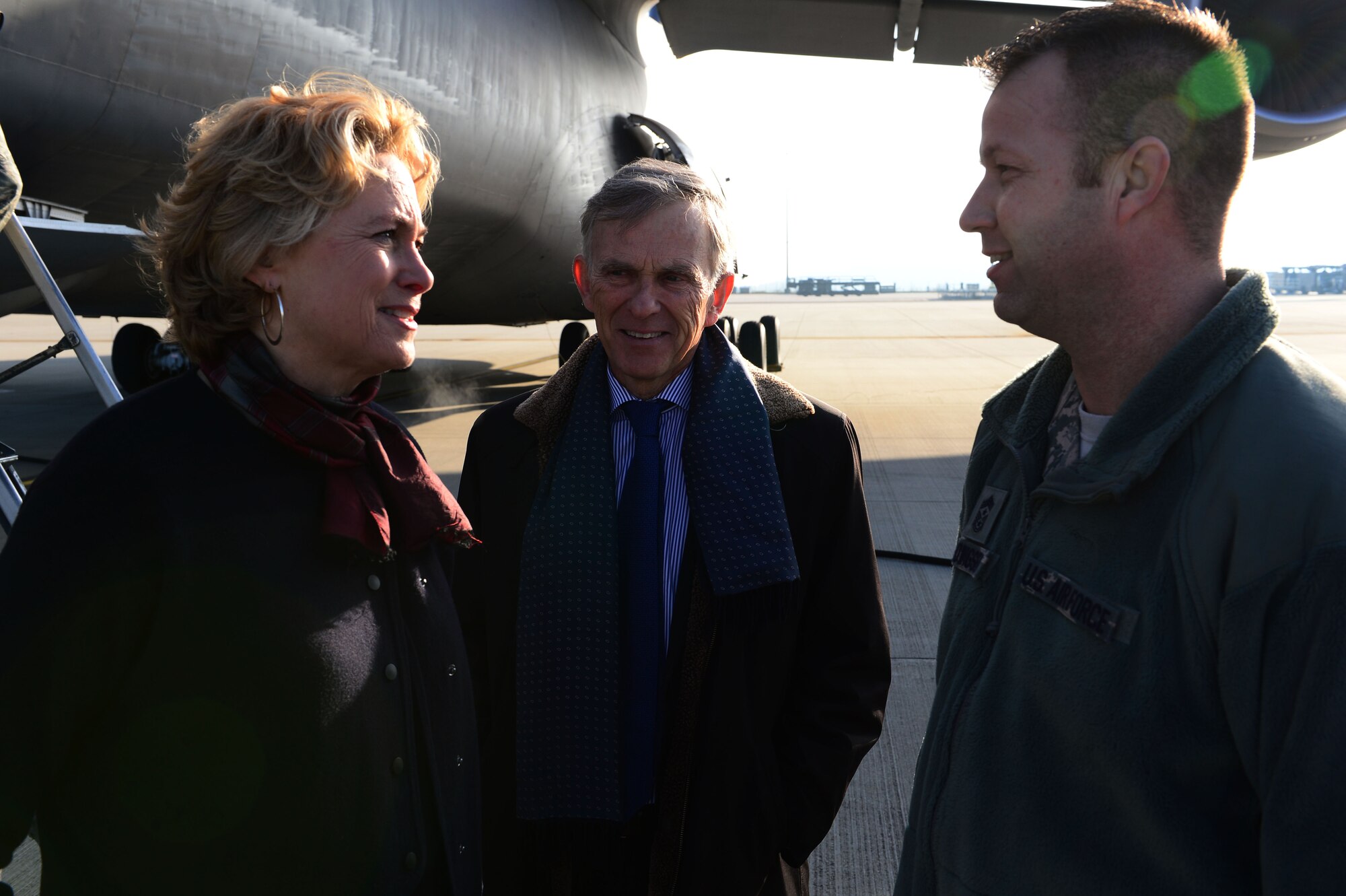 David McKean, middle, U.S. Ambassador to Luxembourg, and his wife Kathleen Kaye, left, talk to Chief Master Sgt. Edwin Ludwigsen, right, 52nd Fighter Wing command chief, on the flightline at Spangdahlem Air Base, Germany, Dec. 20, 2016. This was McKean's first visit to the base as he was briefed by leadership about the Saber Nation mission and different capabilities of the base during his tour. McKean was sworn in as Ambassaor in March 2016. (U.S. Air Force photo by Senior Airman Joshua R. M. Dewberry)