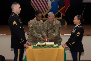 U.S. Army Sgt. Shannon Scott, center left, 221st Military Police Detachment police officer, and U.S. Army Sgt. Maj. Kirk Carlton, center right, Army Training and Support Center senior enlisted advisor, cut a cake during the NCO Corps birthday celebration at Joint Base Langley-Eustis, Va., Dec. 16, 2016. Inspector General Friedrich Wilhelm von Steuben created training objectives that constituted the first written plan for NCO standards, discipline and duty for Gen. George Washington’s Continental Army in Dec. 1777. (U.S. Air Force photo by Airman 1st Class Derek Seifert)