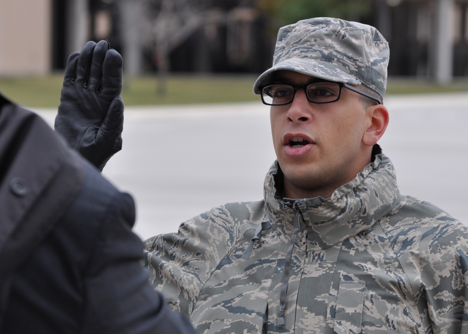 U.S. Air Force Trainee Rachid Karame, 321st Training Squadron, takes his oath of citizenship at the basic military training retreat ceremony at Joint Base San Antonio – Lackland, Texas, Dec. 8, 2016. Trainee Karame became a citizen by joining the Air Force through the Naturalization at Basic Training Initiative. (U.S. Air Force photo by 1st Lieutenant Beau Downey)