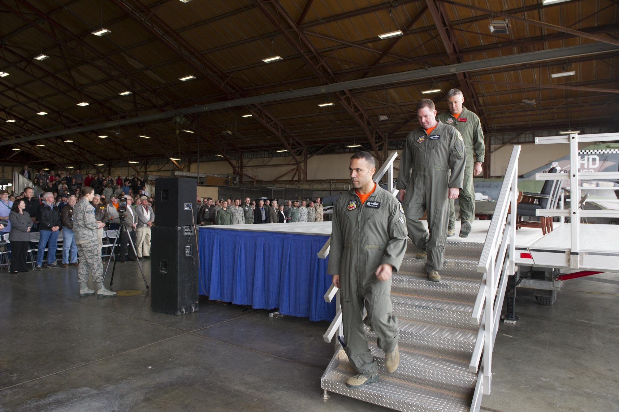 Col. Adrian Spain (bottom), 53rd Wing commander; Col. Lance Wilkins (middle), 53rd Weapons Evaluation Group commander; Lt. Col. Ronald King (top), 82nd Aerial Target Squadron, Det 1 commander, leave the stage after providing their comments during the QF-4 Phinal Phlight ceremony Dec. 21, 2016 at Holloman Air Force Base, N.M. Hundreds of people were in attendance to commemorate the aircraft’s retirement, marking the end of the aircraft’s 53 years of service to the Air Force. (U.S. Air Force photo by Master Sgt. Matthew McGovern)