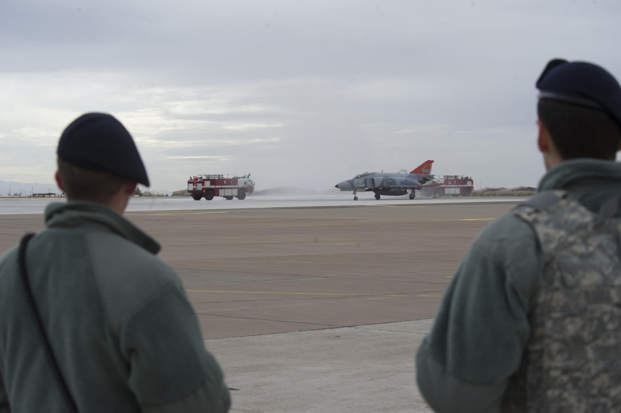 Airmen from the 49th Wing Security Forces Squadron watch a QF-4 Phantom taxi in after its last flight as part of the QF-4 Phinal Phlight event Dec. 21, 2016 at Holloman Air Force Base, N.M. Hundreds of people were in attendance to commemorate the aircraft’s retirement, marking the end of the aircraft’s 53 years of service to the Air Force. (U.S. Air Force photo by Master Sgt. Matthew McGovern)